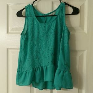 Teal, flowing shirt.